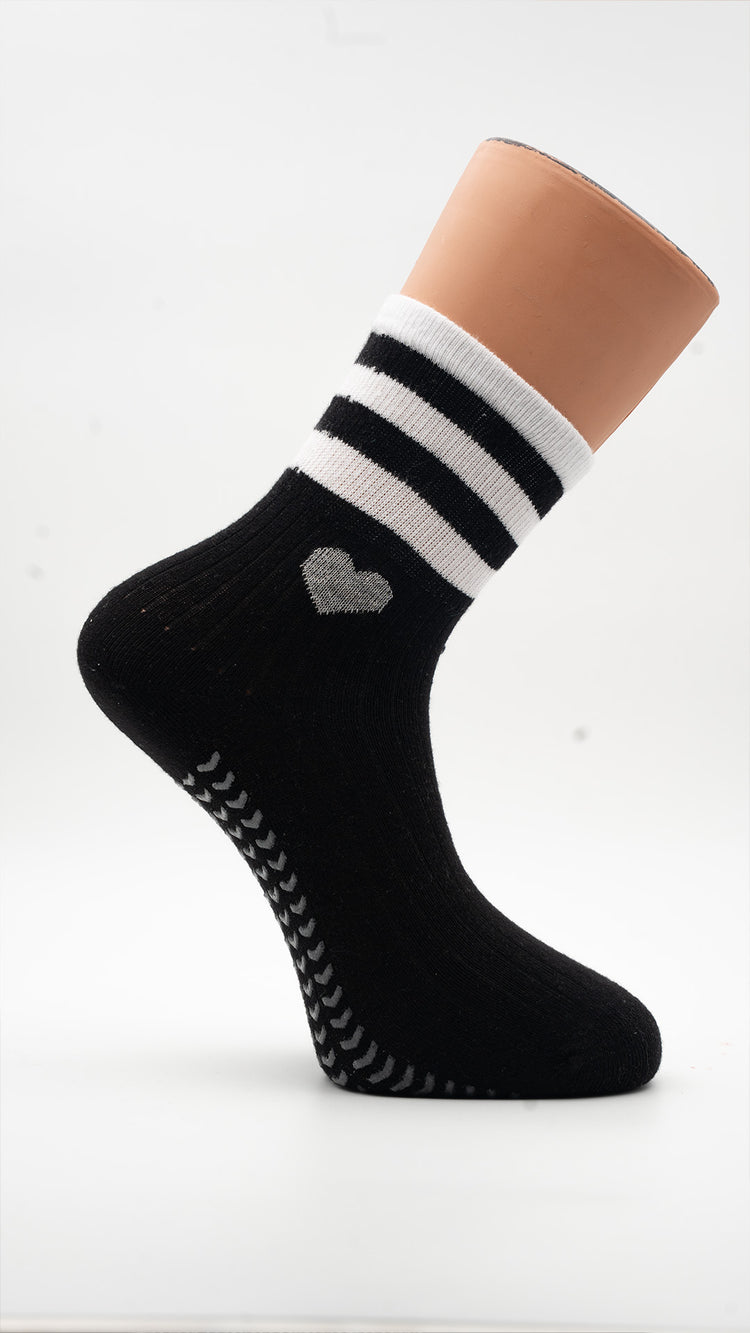 Black Hearts Pilates grip socks with white heart and striped cuff