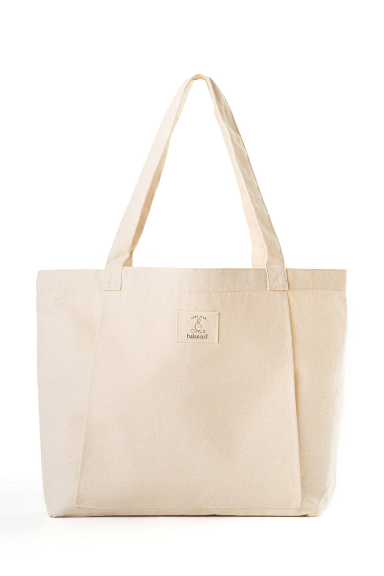 Natural canvas yoga mat bag with shoulder straps and front pocket