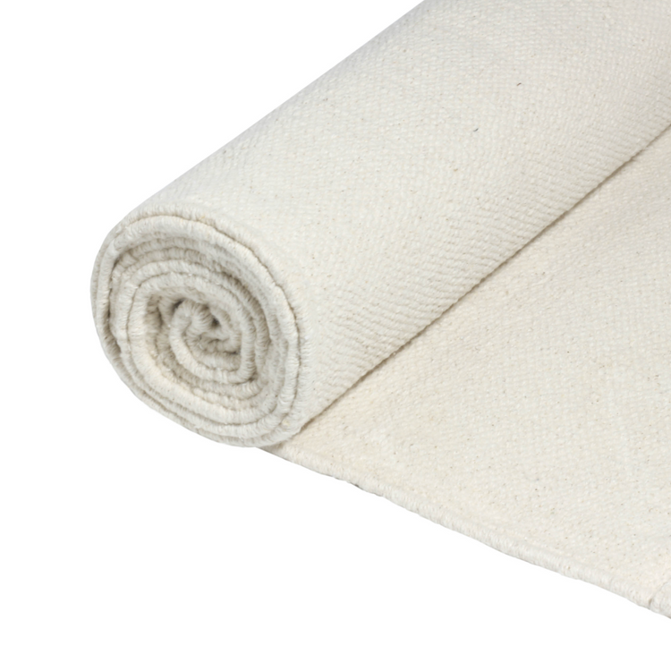Cream The Yogi yoga mat partially rolled