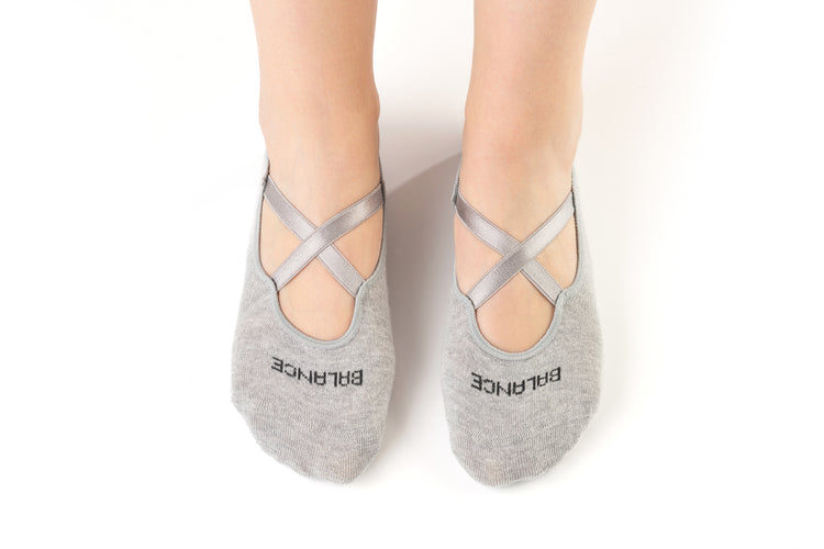 Gray cotton Pilates grip socks with cross straps