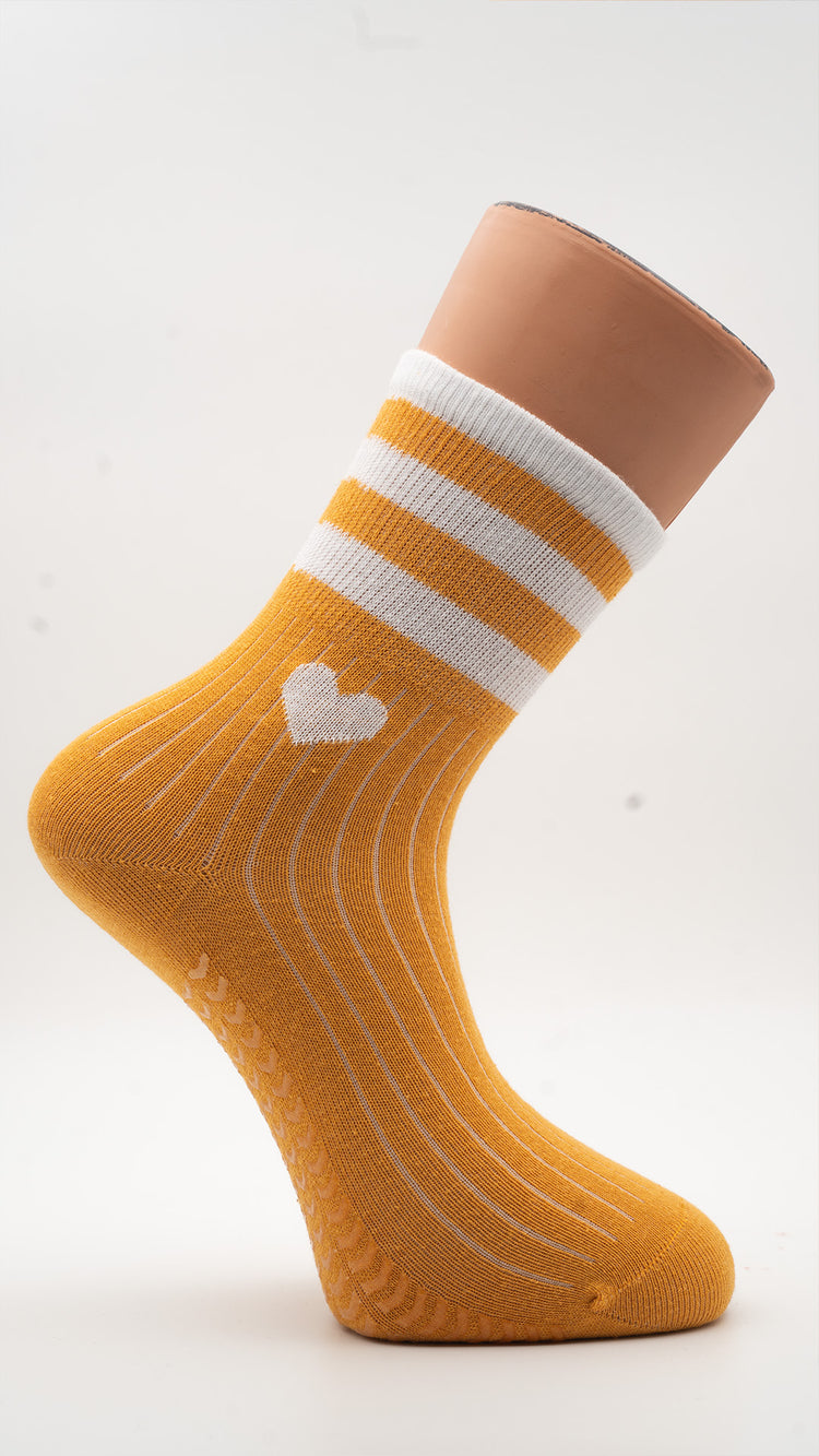 Honey Yellow Hearts Pilates grip socks with white heart and striped cuff