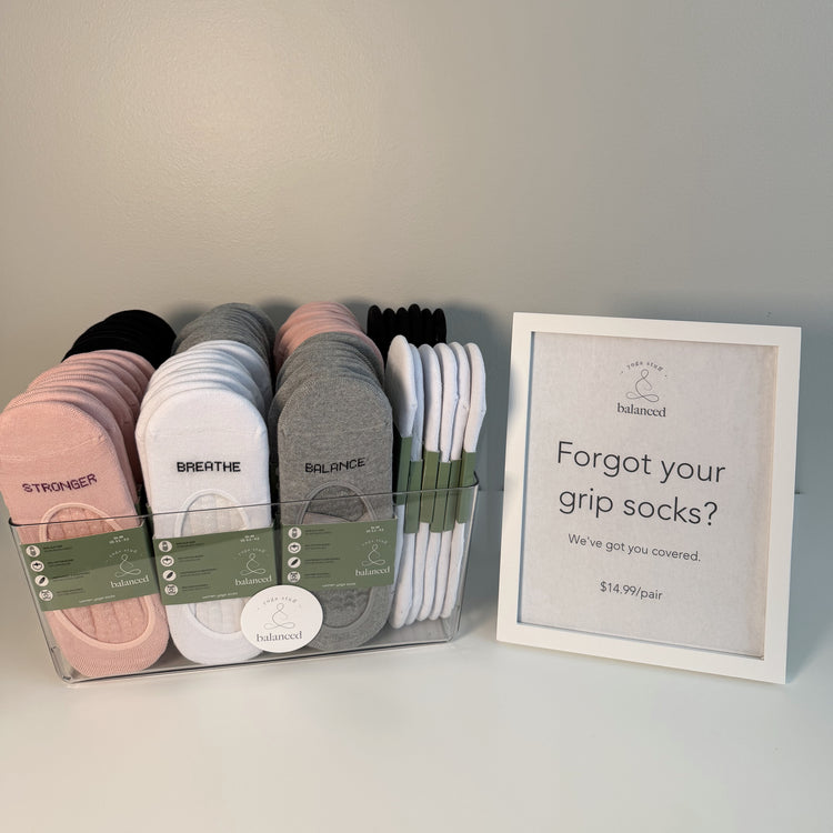 Large studio set of 72 ballet grip sock pairs in a transparent basket — basket with Balanced display sign