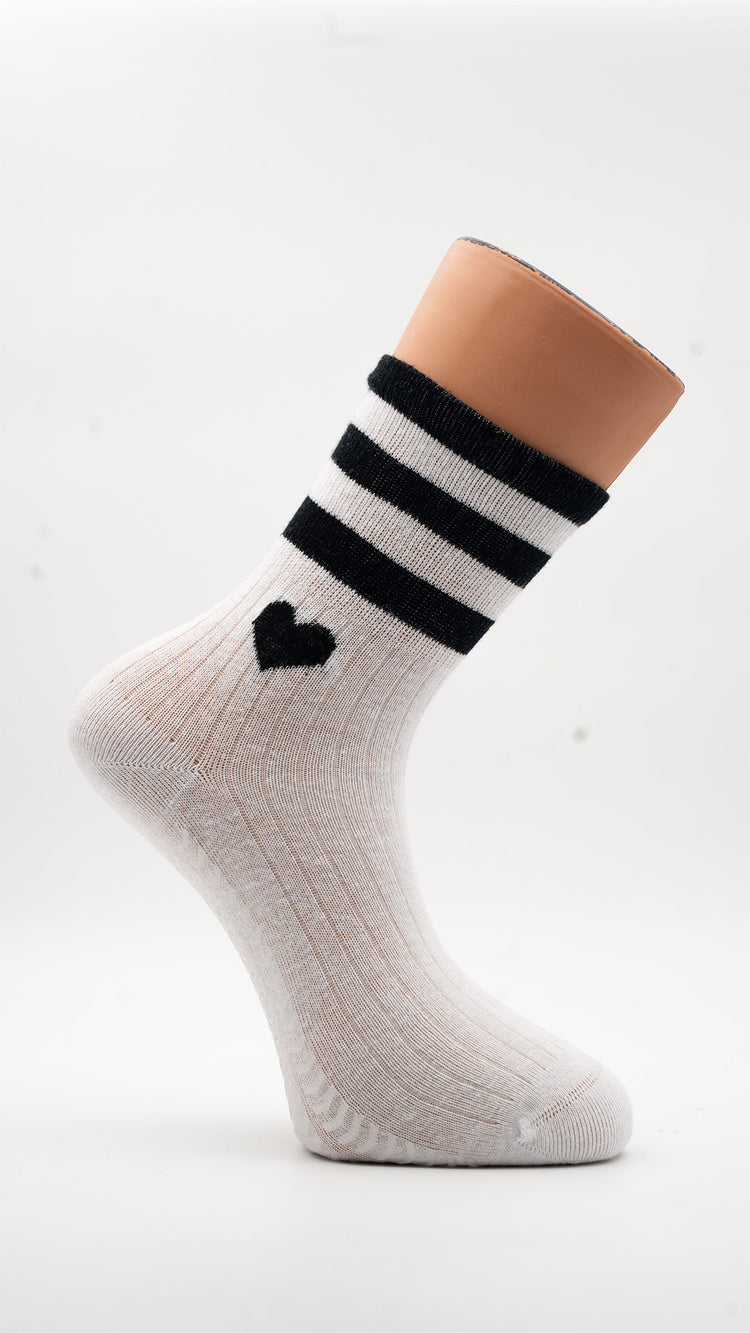 White Hearts Pilates grip socks with black heart and striped cuff